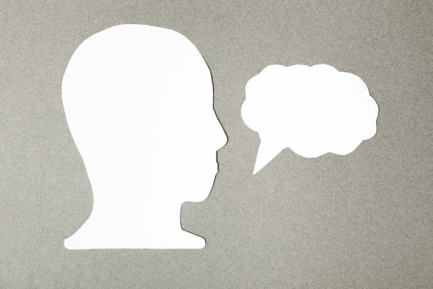 istock paper face and speech bubble on colorbackground copy space for text, communication, symbolic 1416476825