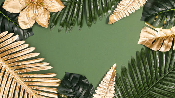 istock Summer exotic palm leaves frame  on green background. Flat lay copy space 1416484214