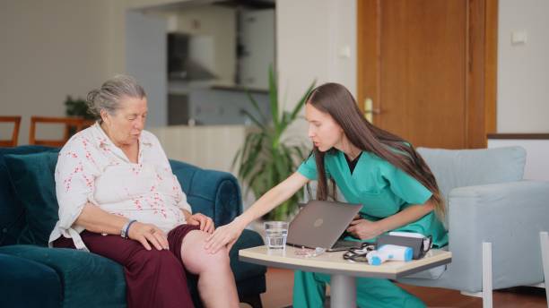 Female doctor visiting her elderly patient at her house for medical check A female doctor is visiting her elderly patient at her house for medical check. blood clot  stock pictures, royalty-free photos & images