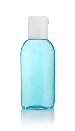 Blue plastic bottle of antiseptic hand gel isolated on white.