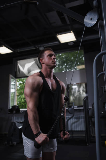 istock Muscular man working out at bodybuilding gym 1416503612