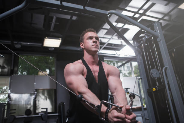 istock Muscular man working out at bodybuilding gym 1416503617
