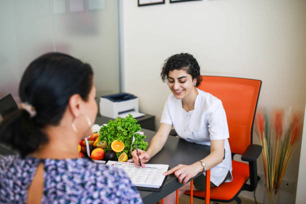 istock Dietician explaining nutritional facts label to client at weight loss clinic 1416504025