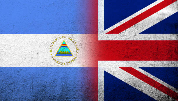 National flag of United Kingdom (Great Britain) Union Jack with The Republic of Nicaragua National flag. Grunge background National flag of United Kingdom (Great Britain) Union Jack with The Republic of Nicaragua National flag. Grunge background flag of nicaragua stock illustrations