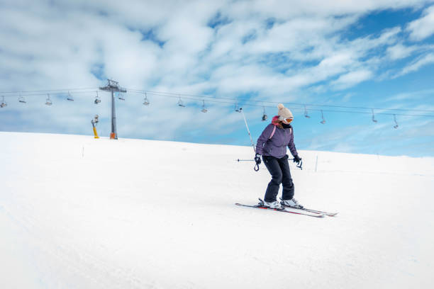 Active lifestyle,  handsome sports  men,  snow skier, skiing, enjoying on sunny ski resorts.  Snowcapped mountain  Ski resort  Val d’iser - Tignes,  Alps,  France, Europe.