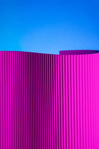 Neon hues over corrugated magenta and blue background.