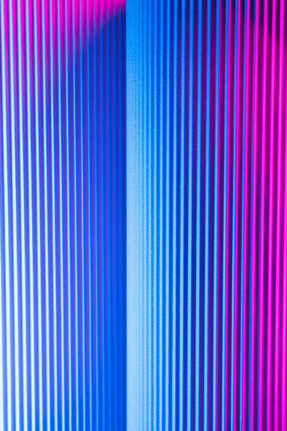 istock Neon hues over corrugated magenta and blue background. 1416524431