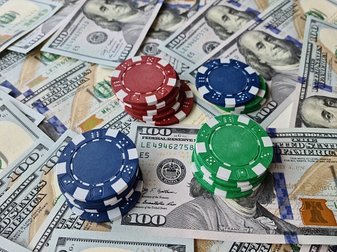 Cash money dollar bills and casino chips. Gambling casino chips and casino tokens