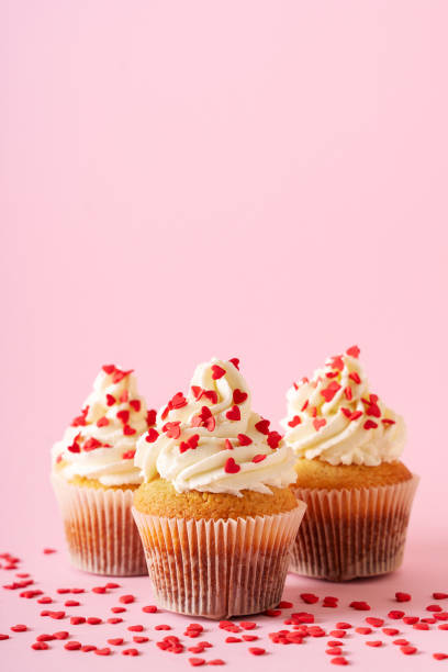 istock Vanilla cupcakes close up on with confectionery sprinkles 1416538069