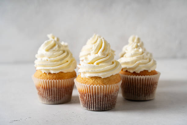 istock Vanilla cupcakes close up on white background 1416538114
