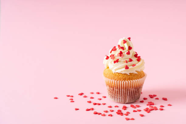 istock Vanilla cupcakes close up on with confectionery sprinkles 1416538120