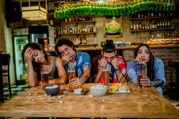 istock Disappointed fans watching a sports game 1416538363