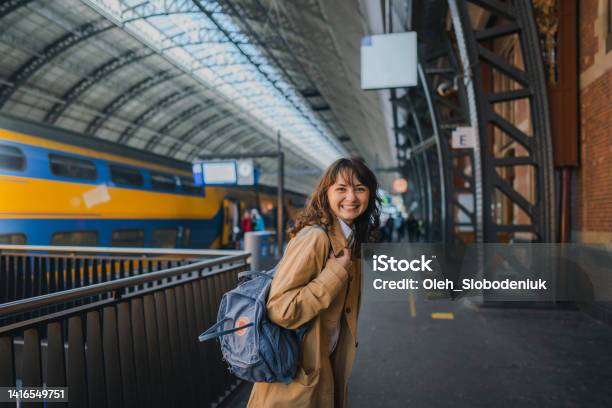Woman Waiting For The Train On Railway Station Stock Photo - Download Image Now - Morning, Netherlands, Subway
