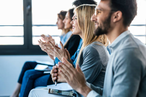 istock Happy business team clapping after listening the conference while sitting on coworking space. 1416550928