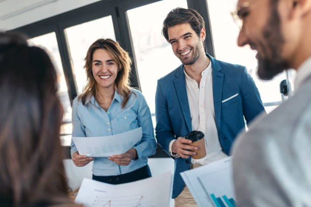 istock Smart business people working while talking of they new project together in modern startup. 1416553199