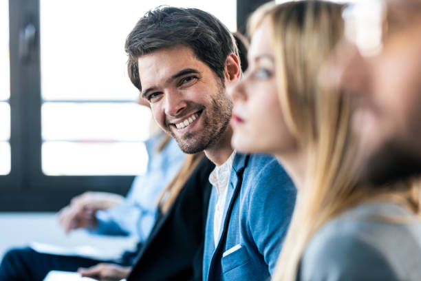 istock Confident business team listening a conference while sitting on coworking space. 1416553785