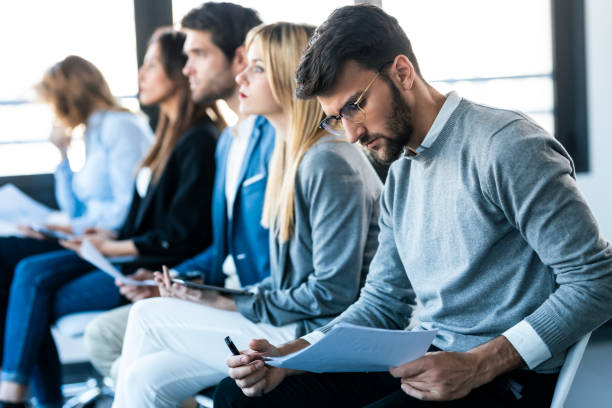 istock Confident business team listening a conference while sitting on coworking space. 1416554126