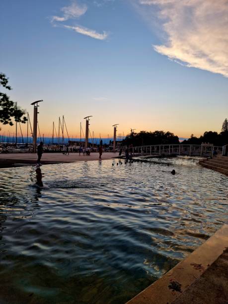 Lausanen Ouchy and lakeside. The image witch several people was captured at dusk during summer season.