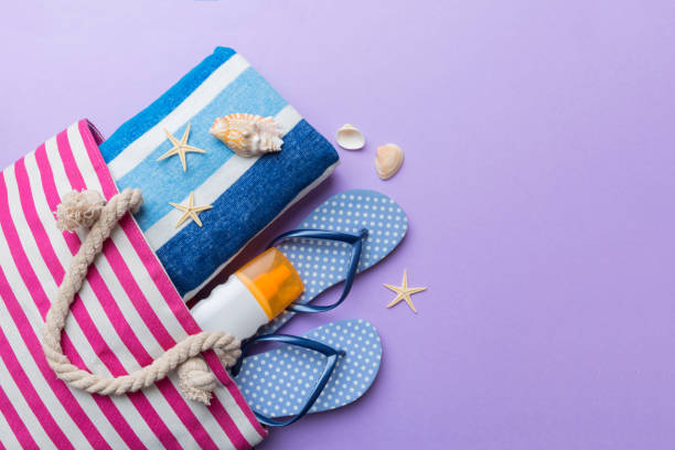 istock beach accessories flat lay top view on colored background Summer travel concept. Bag with starfish and sea shell. Top view 1416576330