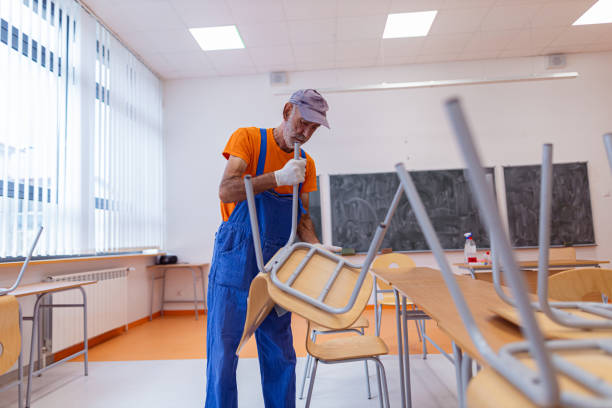 school janitor in the classroom - caretaker imagens e fotografias de stock