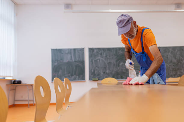 istock Male janitor cleaning surfaces 1416579234