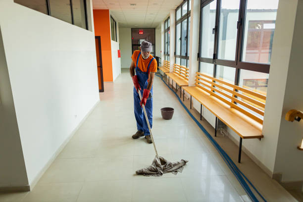 istock Male janitor cleaning corridor 1416584598