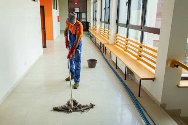 istock Male janitor cleaning corridor 1416585139
