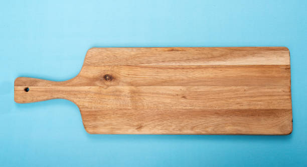 Chopping Board solated On Blue Background stock photo