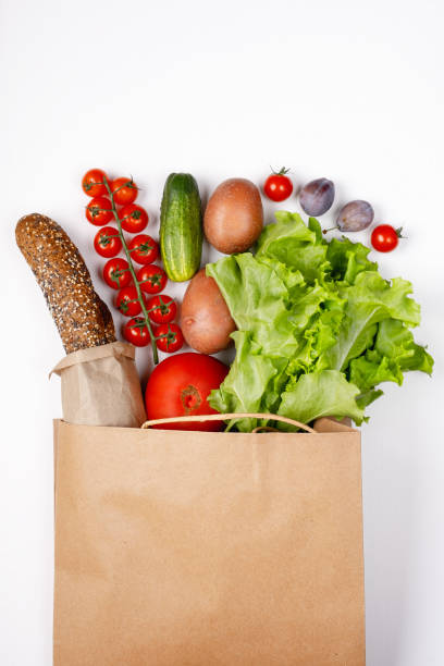 istock Paper bag with different groceries on white background 1416588912