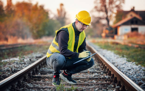 Railroad inspection. Technician found damage on the railway during the inspection. Transportation concept