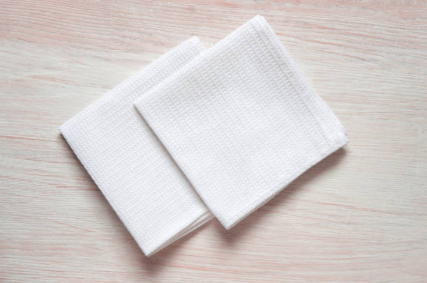 istock White kitchen waffle towel on wooden background. Mock up for design 1416595140
