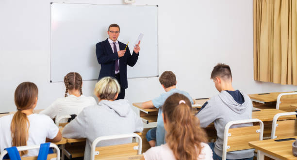 istock Adult teacher is giving lecture for students in class 1416600275