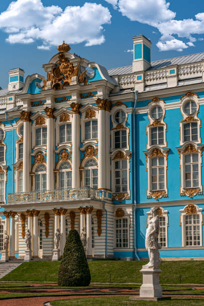 Catherine Palace with a stone statue The ornate neobaroque style Catherine Palace in Pushkin, Russia with a stone statue in the front of it. st petersburg catherine palace palace russia stock pictures, royalty-free photos & images