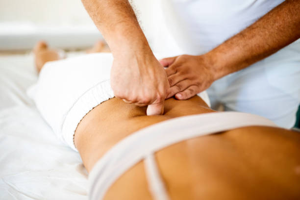 istock Professional masseur working on lumbar vertebra 1416611520