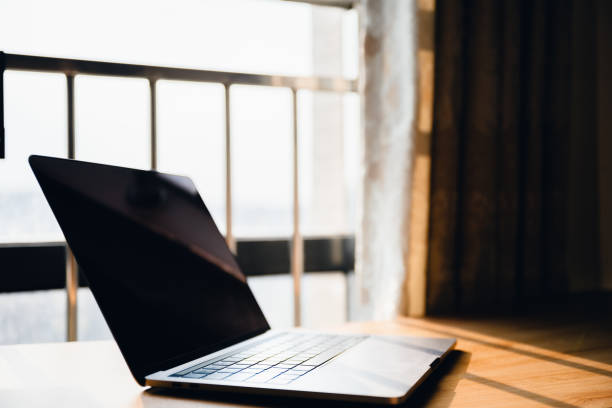 istock Office stationery such as computers at dusk 1416619161
