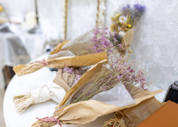 Bouquet of dry flowers on a colored background. For use in floristry, scrapbooking. Country and eco style. Element for scrapbooking. Ornament, bouquet, boutonniere of the dry pressed flowers.