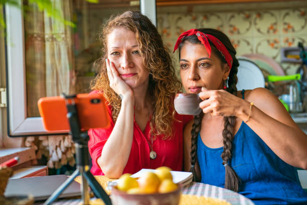 istock Two women having a video call in the kitchen 1416633780