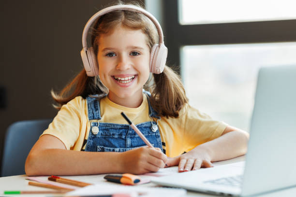 istock Merry girl communicates online teacher 1416643433