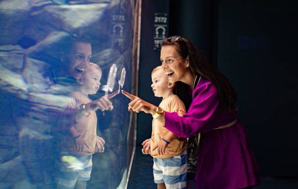 istock Mom and son enjoy the aquarium 1416651402