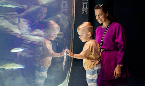 istock Mom and son enjoy the aquarium 1416651935