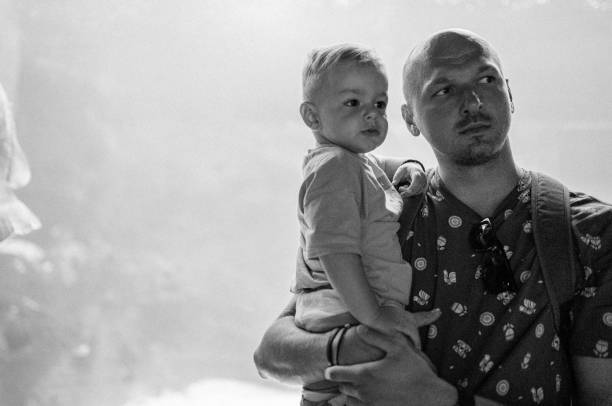 istock Dad and son enjoy the aquarium 1416651939