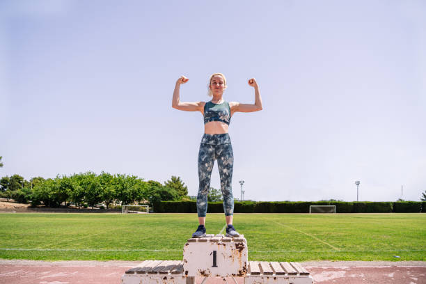 istock Strong sportswoman on first place podium 1416680638