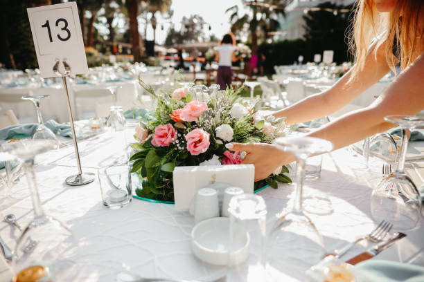 istock Young woman making fresh flowers wedding decoration 1416702770