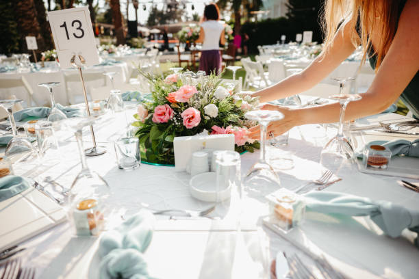 istock Young woman making fresh flowers wedding decoration 1416702956