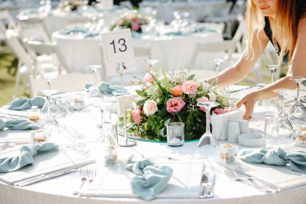 istock Young woman making fresh flowers wedding decoration 1416703045