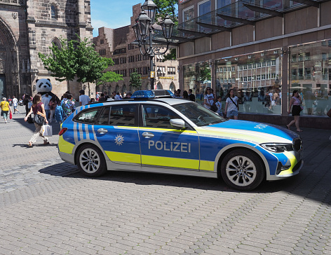 Nuernberg, Germany - Circa June 2022: Polizei translation Police car in the city centre