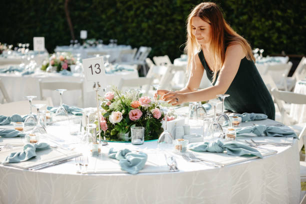 istock Young woman making fresh flowers wedding decoration 1416704580