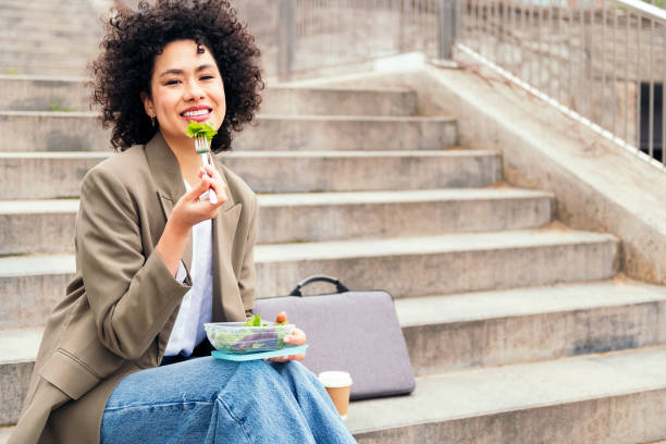 woman eating a salad during a break from work