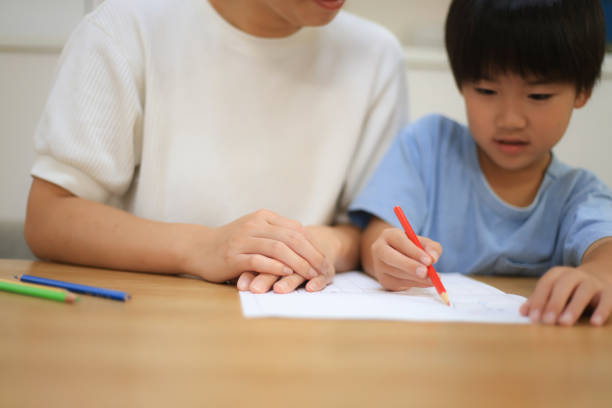 istock Parent and child drawing a picture diary 1416713036