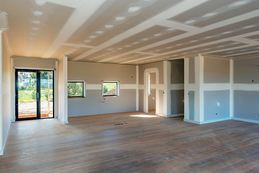 Residential home interior with plasterboard and newly laid timber flooring